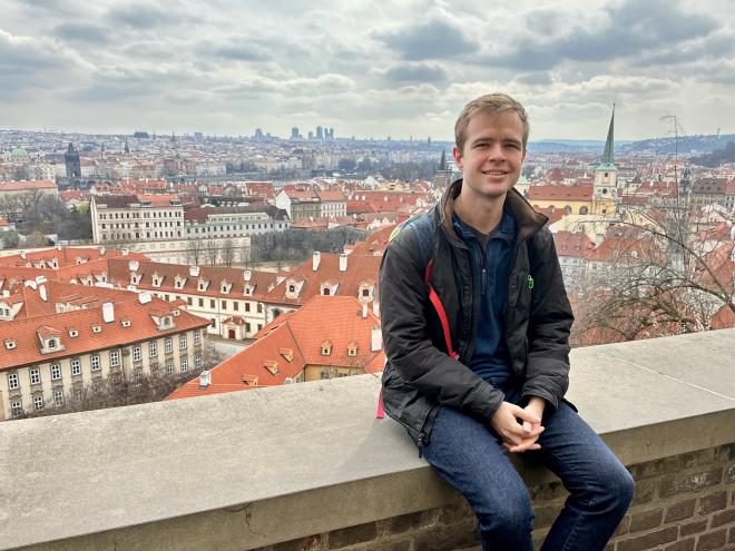 Sitting on a wall overlooking Prague, Czechia